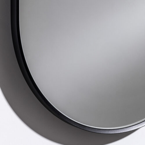 Detaljbild slutfinish elegant dekorativ spegel i svart MDF